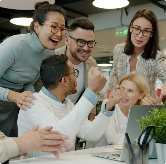 Colleagues working together around a laptop